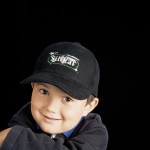 Boy smiles because his flooring is non toxic because of the concrete sealer, which makes him happy.