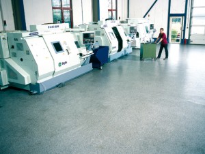 Workers enjoy a dust free work zone with the newly installed acrylic flooring adhesive applied to the warehouse flooring.