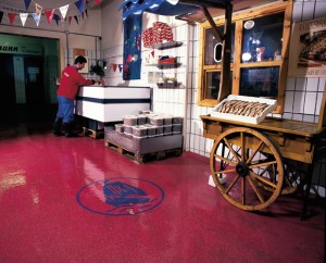 Supermarket uses floor graphic to direct customers to seafood section of grocery store.