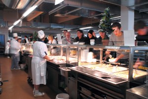 An open buffet with a line of patrons rests proudly on a newly installed commercial food grade flooring system.