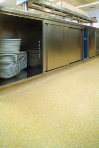 A self leveling floor underlayment saved this kitchen floor from needing costly removal of old tiles.