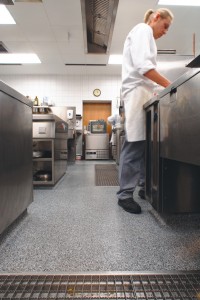 Commercial food grade flooring protects against the chef's spillage as he prepares his prep table.