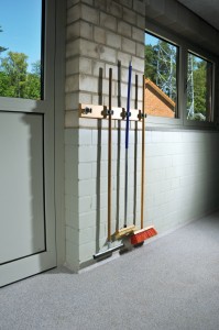 A dog kennel access hallway proudly displays the best resist flooring for dog urine.