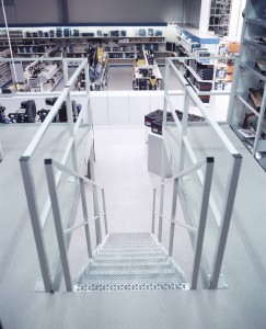 Steps with rails incorporate a floor protect product in the new flooring surrounding.