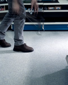 Close up of mans feet as he walks across protective floor products.