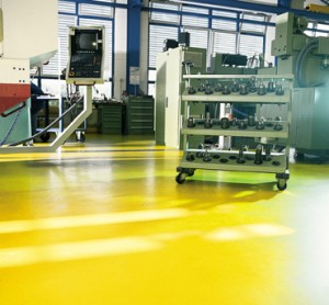 A body shop concrete sealer non flammable flooring system gleams in the sunlight.