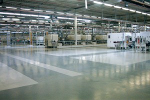 A floor system coating supplier provided the expertise necessary for the perfect flooring installed in this large manufacturing facility depicted.