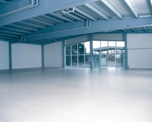 A new warehouse floor system proudly displays the floor leveling liquid compound that restored its once damaged surface.