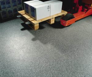 A pallet jack moves materials across a non skid floor finish additive with ease.