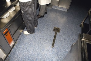 Resurfaced kitchen flooring coats the once old tile floor.