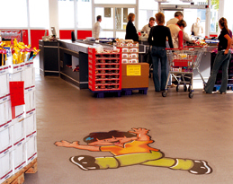 Industrial flooring ideas brought to life this animated floor graphic, perfect for this check out counter area.