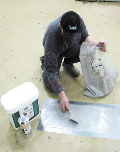 A professional epoxy concrete repair is visibly underway by this professional installer.