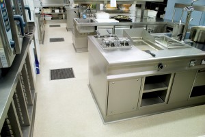 A commercial kitchen floor closes house for the night knowing that the newly installed voc free floor finish will keep things nice and neat for the morning shift.