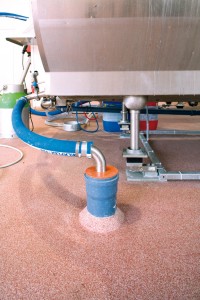 An industrial holding tank performs optimally while surrounded by a new no voc floor finish.