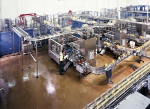 Large chemical producing assembly line floor system shines bright with resistant top coating. 