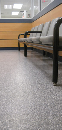 Waiting Room Chairs On Medical Office Flooring In Commercial Building.