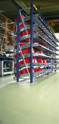 Automotive Parts Stacked On Shelves Over Dense Industrial Floors.