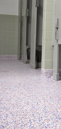 Superior Flooring In A Bathroom With Stalls.