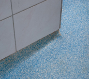 Blue acrylics bring color to an impregnated flooring system.