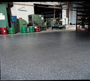 Bright grey floor coat protects previously cemented store room.