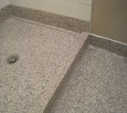 Shower floor of decontamination area is accented with proper drainage.