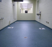 A vibrant blue floor keeps this decontamination area looking clean.