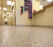 A clean floor shines in this empty emergency room waiting area.