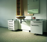 Office bathroom area presents cool setting with seamless floor system.