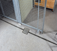 Intricate flooring system hides institutionary slide gate roll and drain system.