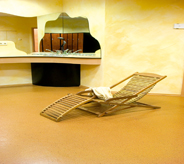 A low maintaining floor system provides maximum comfort for this bathroom setting displaying a wooden reclining chair center.