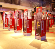 Sports meseum with display cases on cream colored floors.