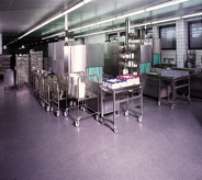 Commercial kitchen flooring seamlessly blends cool color with stainless steel surroundings.