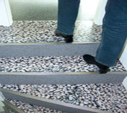 Stones look alike comprise floor coating over concrete stairs.