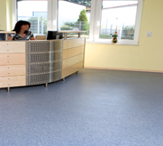 Reception area flooring protected by impregnated acrylic.