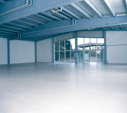 Hangar aircraft warehouse shines blue with new floor coat.