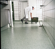 Helper rolls water bucket across best resistance floor system.