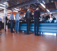 People move frequently across cafeteria flooring.