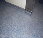 Cool blue coating protects cement wall corner.