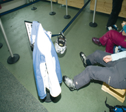 People sit in chairs on top of climate adaptive flooring.