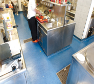 Ocean blue concrete coatings protect floor and base trim while prep cook prepares for day.