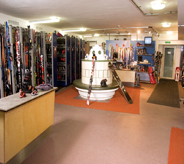 Multi colored concrete floor coatings brighten a spacious ski shop.