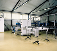 Machinery sits atop of a control room floor.