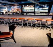 Cruising ship's bar room flooring adds calming appeal with neutral tan color scheme.