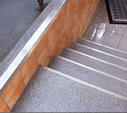 Stairs leading down to a dairy processing area.