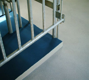 This gate allows entry to step upon the decontamination area floor.