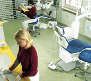 Doctors work standing on dental office floor.