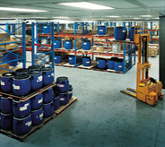 Acrylic flooring covers vast space of distribution warehouse complete with racks and forklifts.
