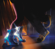 Feet dance on concreted interior floor sealed for protection.