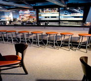 Stools aligned neatly across restaurant floor.