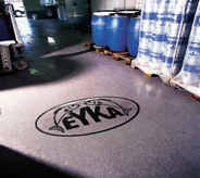 The company logo is proudly displayed in the floor of this seafood processing plant.